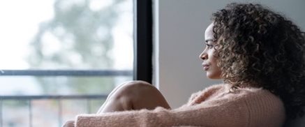 Woman sitting at window